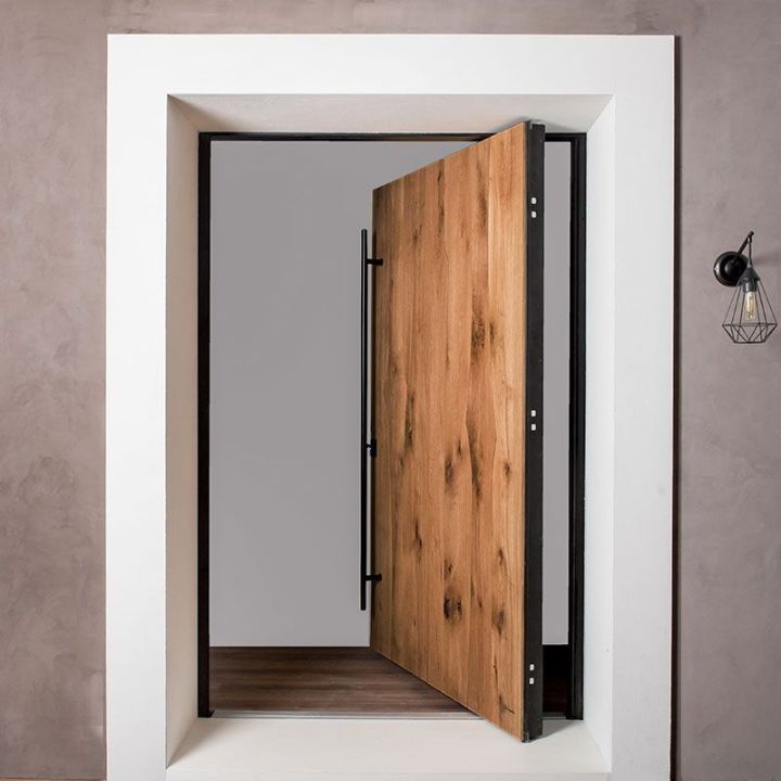 La porte sur pivot blindée en chêne massif La porte sur pivot blindée en chêne massif
